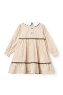 Back flat lay of sand striped dress with white peter pan collar, brown piping and lace trim at waist and hem on white background