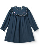 Navy blue dress with lace details on a white background