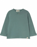 A sage green long-sleeve top with a half-zip neckline, displayed flat against a solid white background.