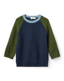 Navy ribbed knit sweater with olive green sleeves and light blue neckline trim, flat lay on white background