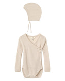 Beige baby bodysuit and hat set on a white background