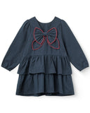 Navy plaid dress with red stitched bow front, long sleeves and tiered ruffle skirt, flat lay