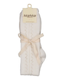 Gentle white pointelle knit knee socks folded in MarMar Copenhagen packaging, tied with cream ribbon