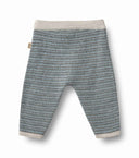 Wool knit baby trousers in bluey speckled melange with cream ribbed waistband and cuffs, flat lay with Wheat brand tag visible