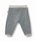 Wool knit baby trousers in bluey speckled melange with cream ribbed waistband and cuffs, flat lay with Wheat brand tag visible