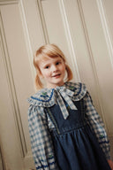 Blue and white plaid baby blouse with embroidered flat collar, lifestyle photo