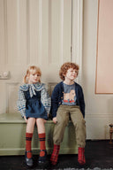 Blue and white plaid baby blouse with embroidered flat collar, lifestyle photo
