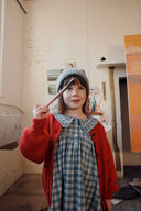Blue and grey check baby dress with ruffle collar, lifestyle photo