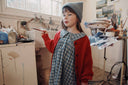 Blue and grey check baby dress with ruffle collar, lifestyle photo