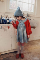 Blue and grey check baby dress with ruffle collar, lifestyle photo