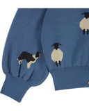 Dusty blue jacquard cardigan with white sheep and border collie pattern and ruffle collar, additional view