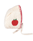 Cream sherpa baby bonnet with red apple embroidery and green leaves, ties at chin