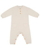 An off-white long-sleeve baby romper with a Henley-style neckline, three wooden buttons, two front patch pockets, and snap closures on the legs, shown on a plain white background.