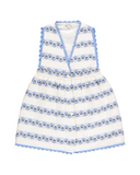 White dress with blue floral patterns on a white background