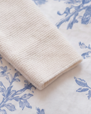 Close up of ribbed knit cuff on off white cashmere sleeve, garter stitch texture