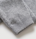 Close up of ribbed ankle cuff on heathered grey cashmere leggings