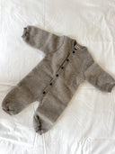 Khaki melange merino wool fleece bunting suit with button front, flat lay on white sheet