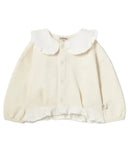 A cream-colored long-sleeve baby cardigan featuring a large ruffled Peter Pan collar, button front, and ruffled trim on the hem and cuffs, shown against a plain white background.