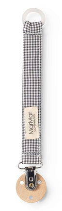 Close up of black and white checkered pacifier strap with MarMar Copenhagen label and wood clip