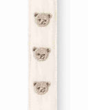Close up of cream pacifier strap with embroidered teddy bear face details