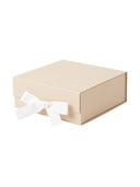 Beige gift box with embossed MarMar logo and white ribbon bow, closed