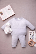 Tartine et Chocolat baby wool cashmere top and bottom set, light grey melange, flat lay styled with a plush lamb toy and open storybook