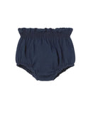 A pair of navy blue baby bloomers with a ruffled waistband, photographed flat against a solid white background.