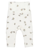White baby leggings with a scattered gold and brown animal print, shown flat against a white background.